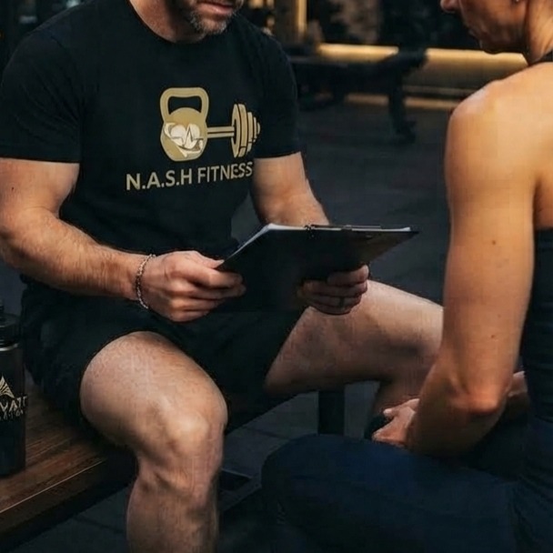 Personal trainer and client reviewing a fitness and nutrition plan